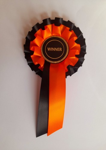 Winner orange and - , black